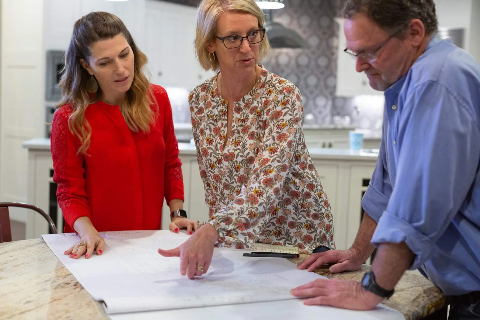 Designer reviewing plans in showroom